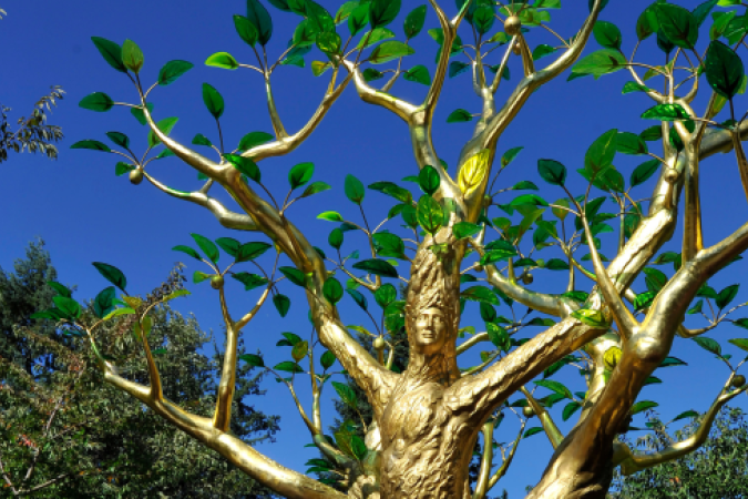 Golden Tree memorial, a sculpture of a gold-painted tree depicting three women with clear green leaves