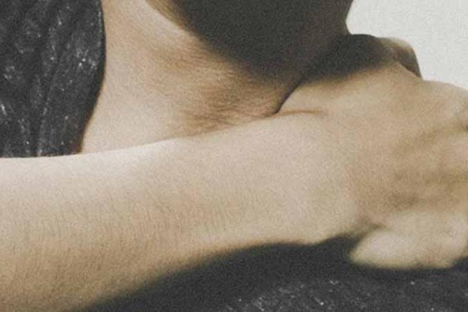 Person holding shoulder