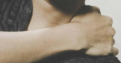 Person holding shoulder