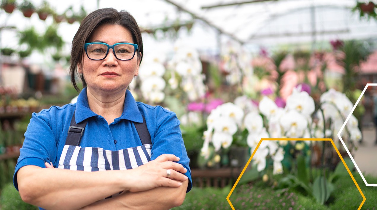 Worker in a florist greenhouse